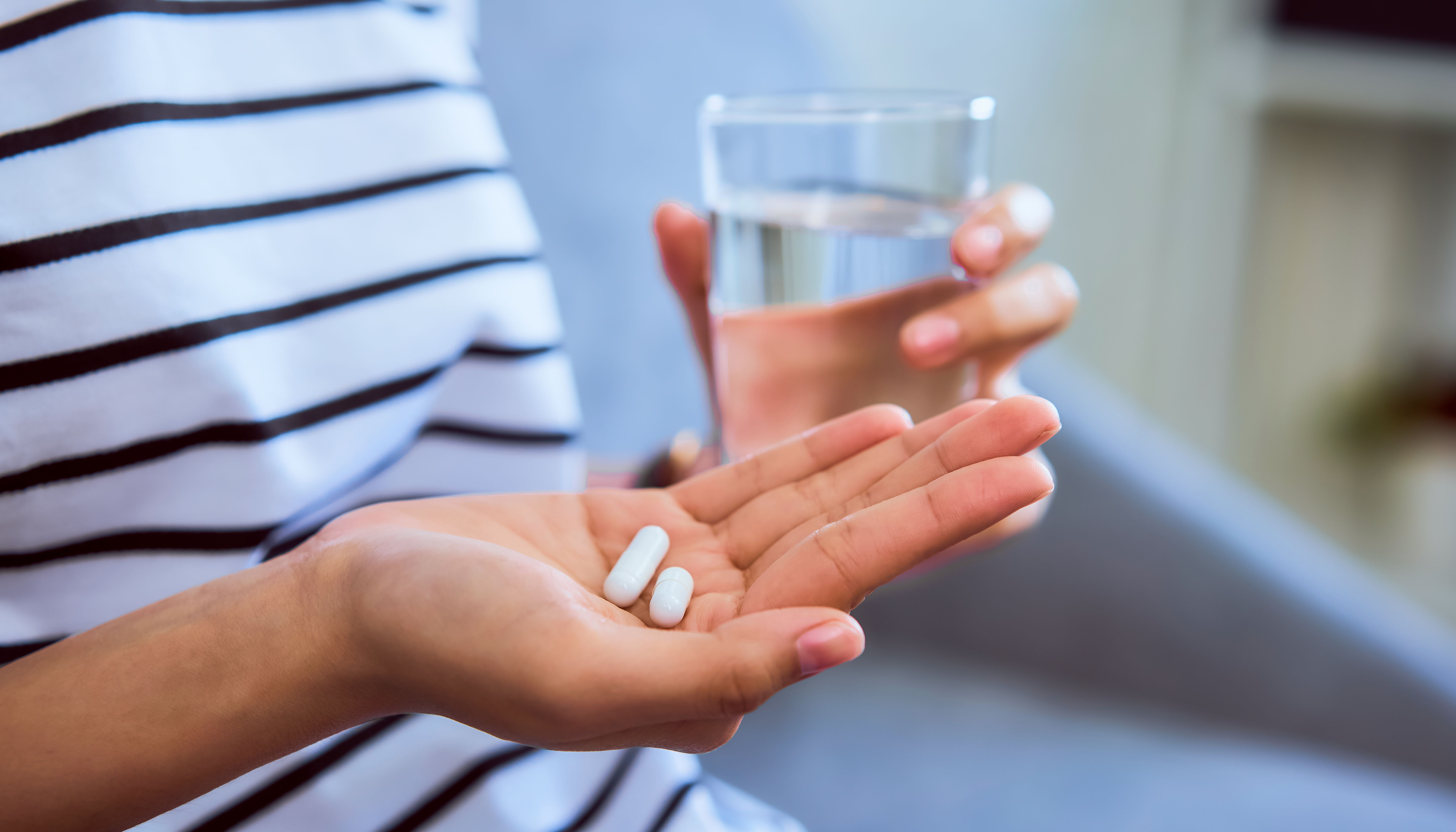 Patient takes medication. | Image Credit: sitthiphong - stock.adobe.com