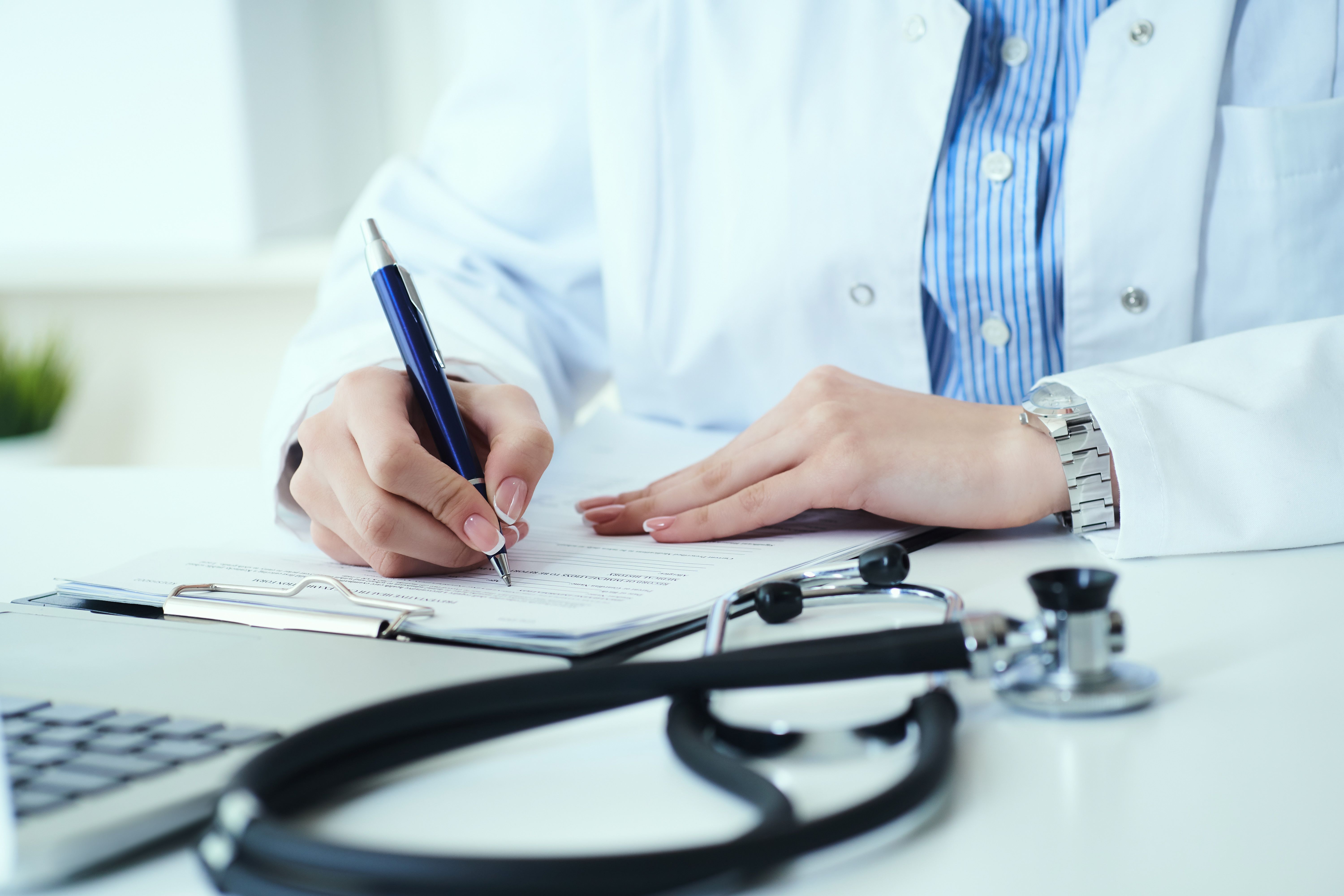 Doctor Writing on Prescription Pad | image credit: cameravit - stock.adobe.com