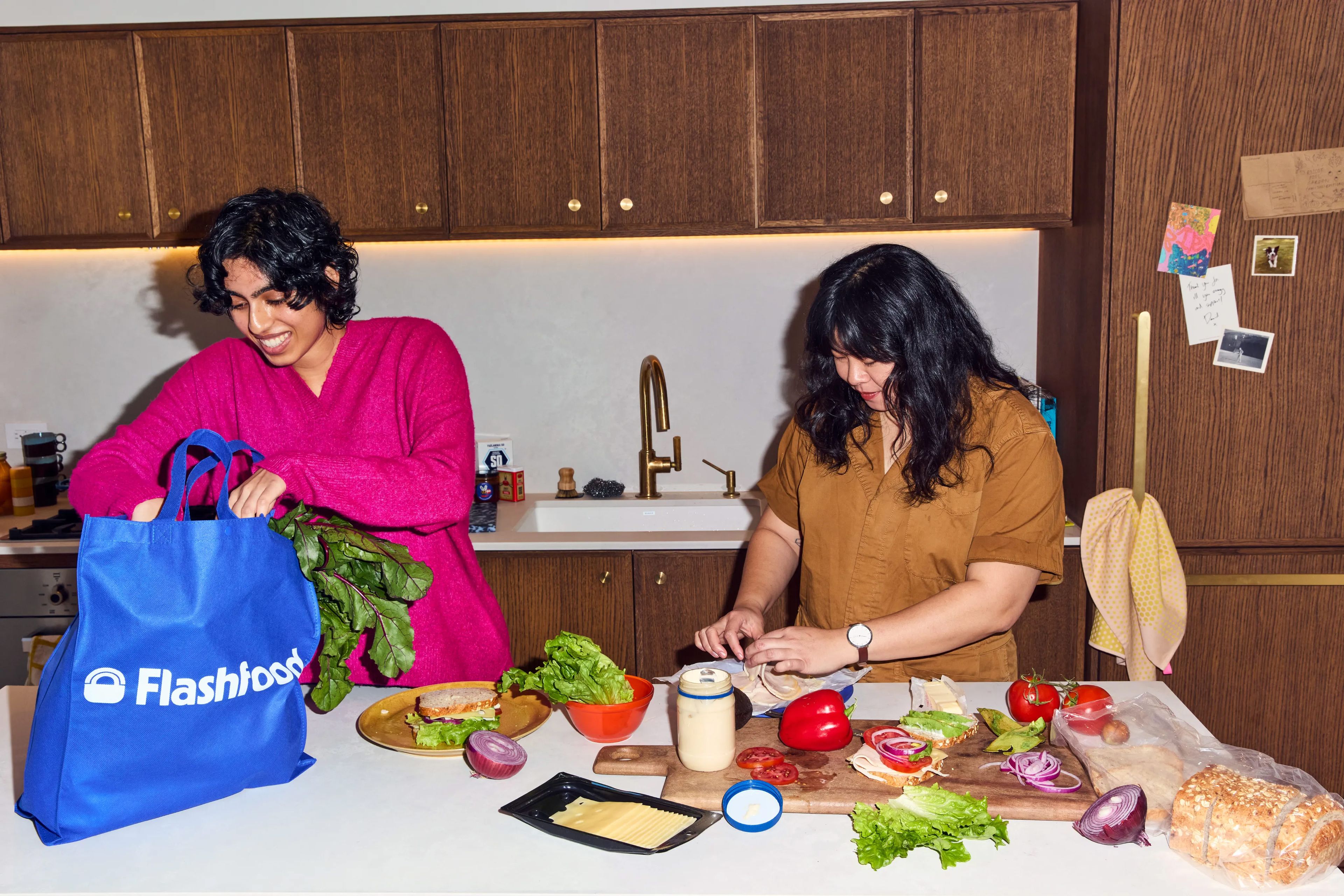Two people prepping food on a counter