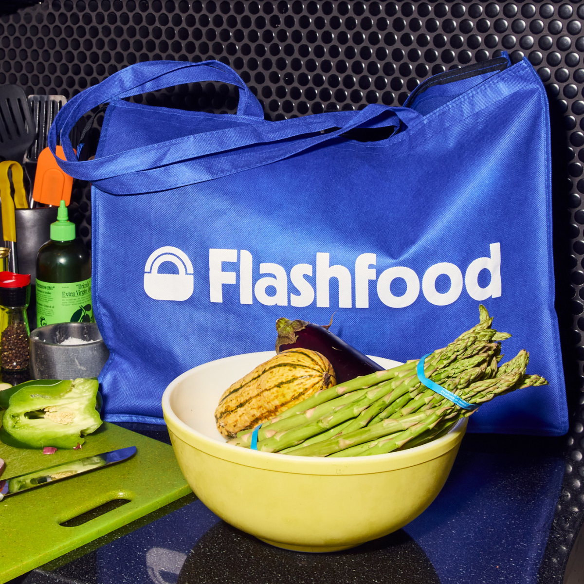 Flashfood bag on counter with selection of food being prepared
