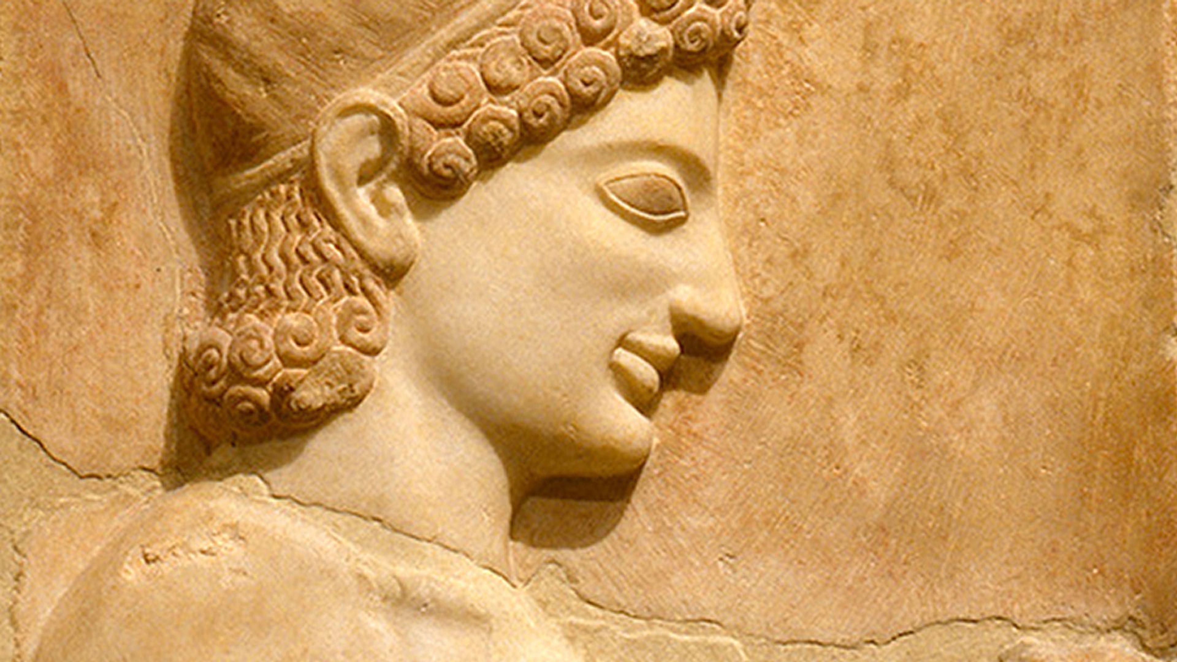 Carving on a marble stele of a young man.