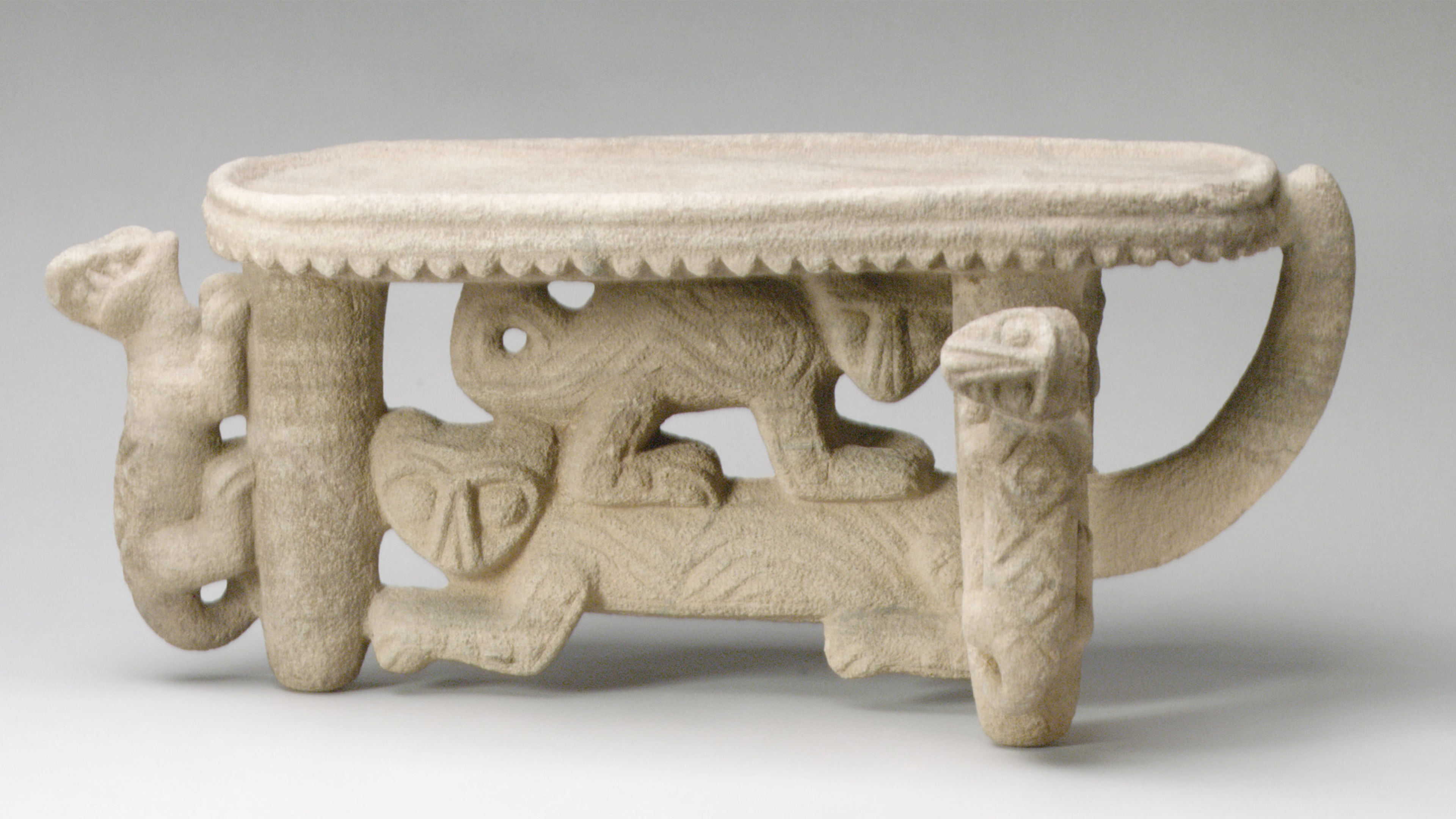 A flying panel metate (tablelike object of stone) with five felines worked into the legs on the metate's underside