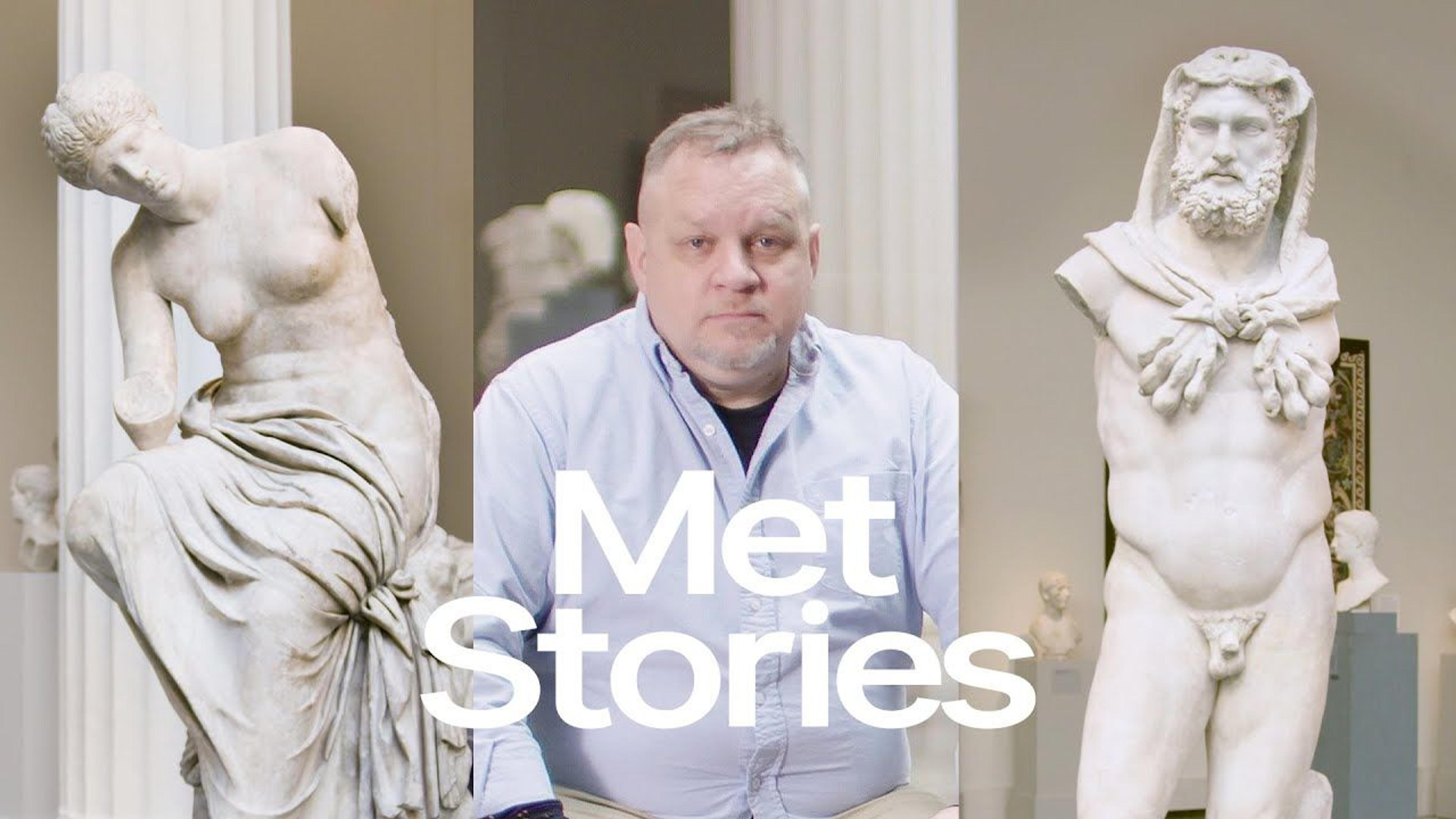 Composite image of Michael Zacchea siting in the Greek and Roman galleries at The Met, flanked by two Greek and Roman statues to either side; the text "Met Stories" appears in the center of the image