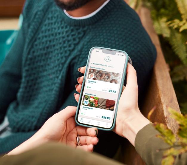 a person is holding a cell phone in their hand .