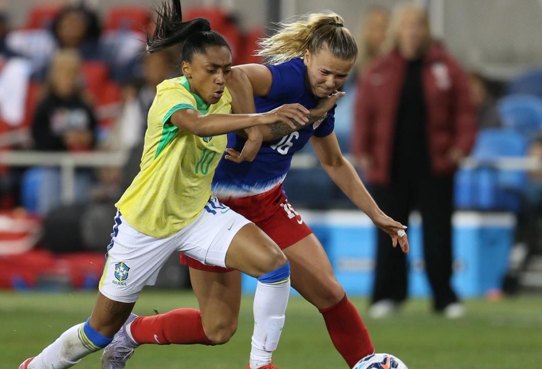 Claire Hutton and Kerolin battle for the ball during the USWNT vs Brazil match