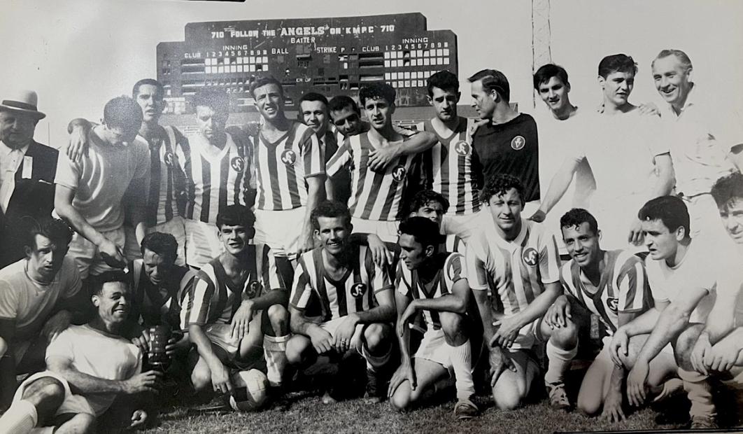 The 1964 LA Kickers team photo with the Angels scoreboard in the background